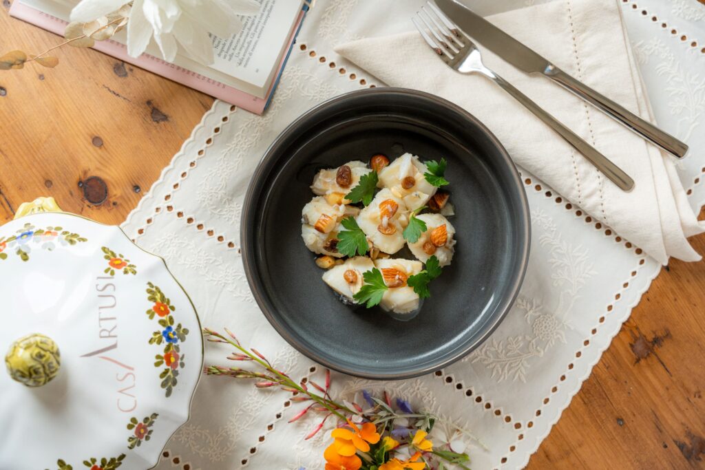 Ricetta realizzata in collaborazione con Casa Artusi con baccalà e mandorle
