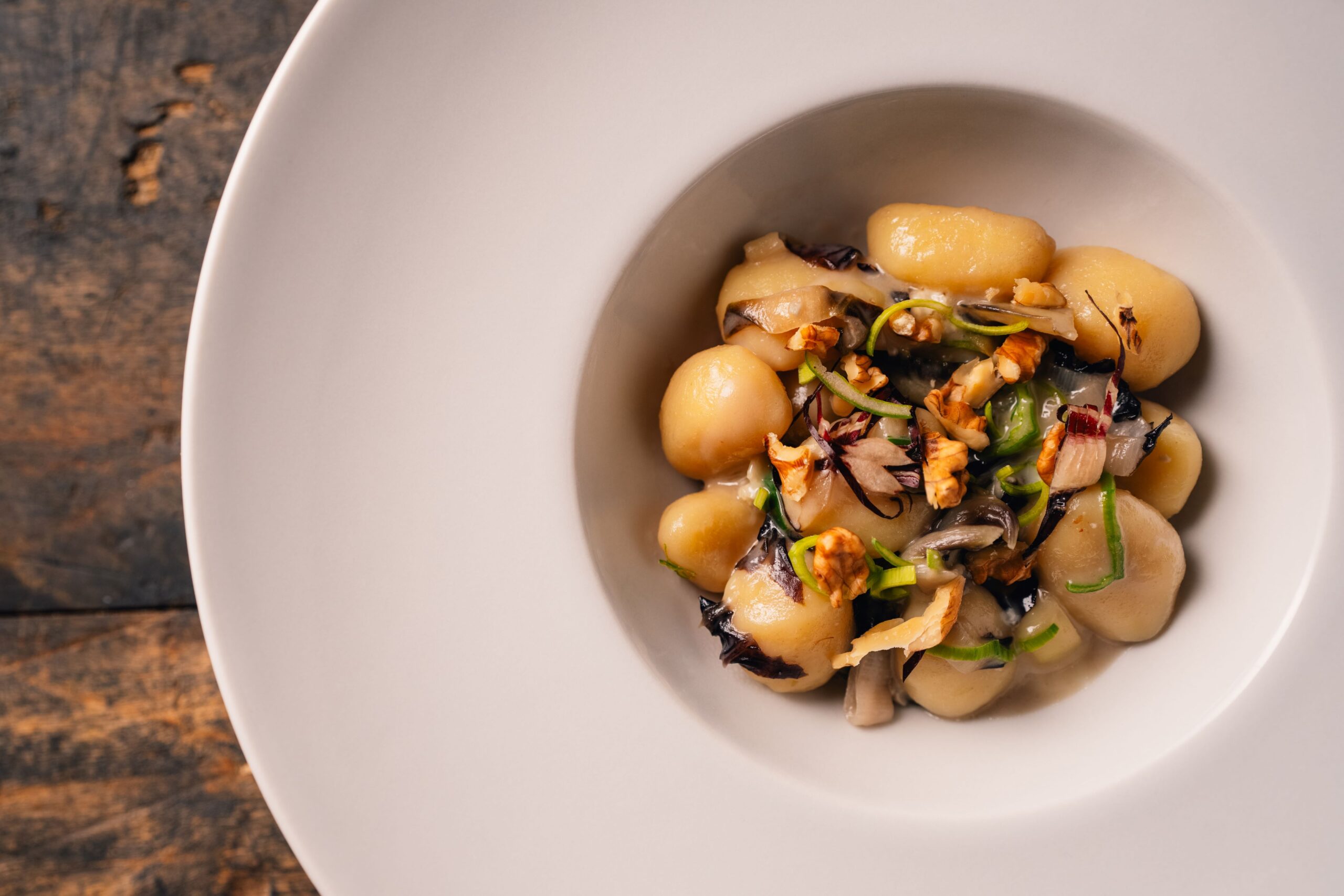 Potato gnocchi with leeks, radicchio, gorgonzola and walnuts